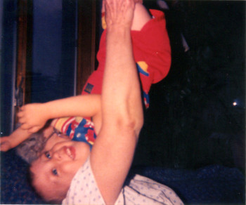 My brother Nick being lifted high in the air by our grandma – one of my first photographs taken with a 110 camera (1991)